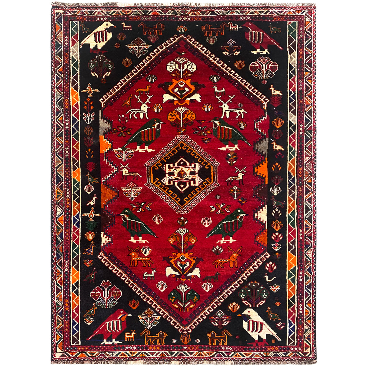 Shiraz Qashqai-Teppich mit rotem Mittelmedaillon, schwarzem Hintergrund und Zierbordüre