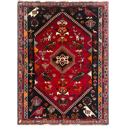Shiraz Qashqai-Teppich mit rotem Mittelmedaillon, schwarzem Hintergrund und Zierbordüre