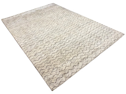 Cremefarbener Wollteppich im Berber Stil mit fließenden Linien